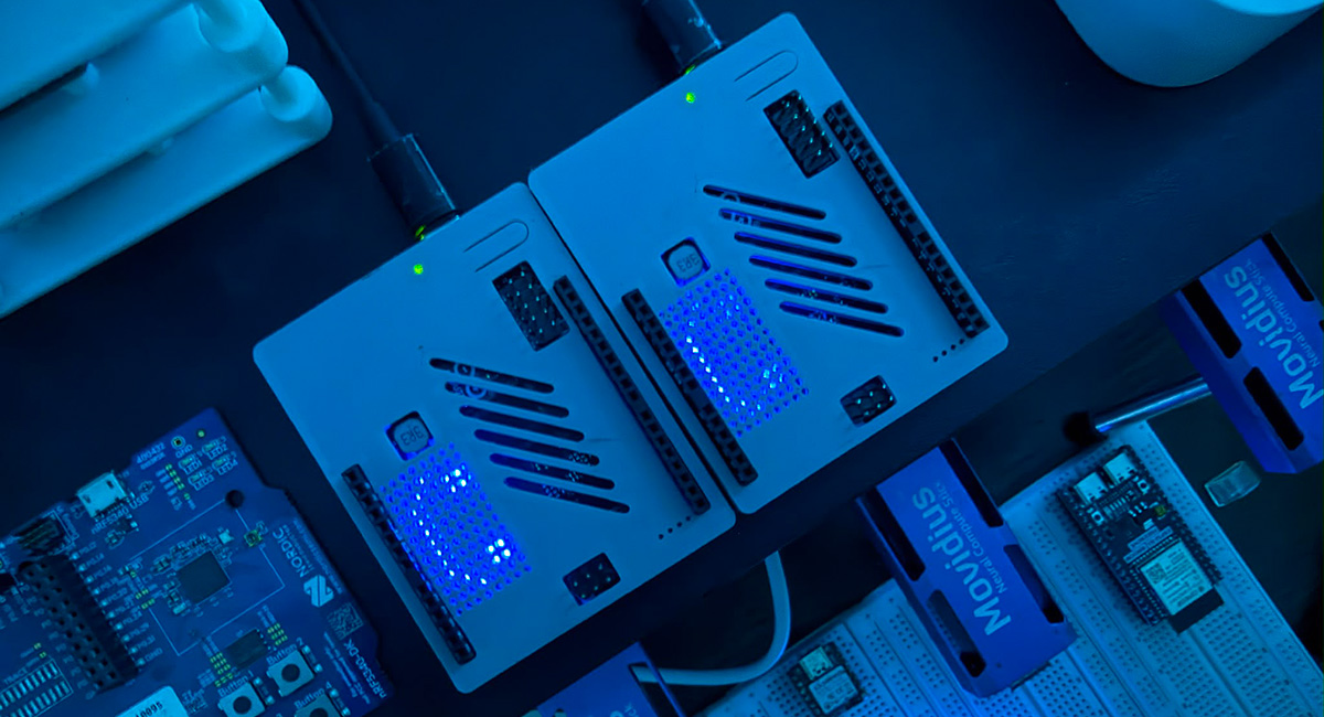 Two Arduino UNO Q boards in 3D printed cases